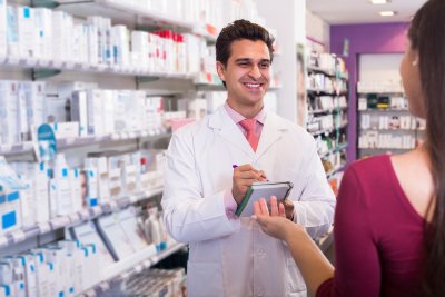 pharmacist counseling the woman for medicine