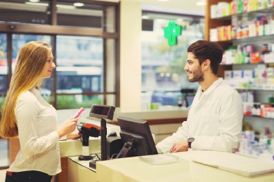 pharmacist and woman looking each other